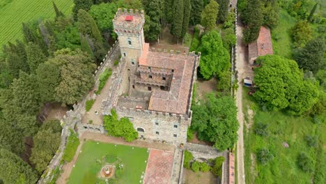 Rotating-around-historic-Castello-di-Vincigliata-built-on-top-of-rocky-hill