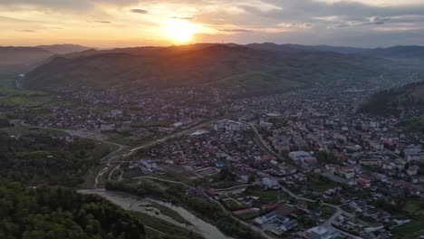 Drone-hyperlapse-at-sunset-over-Gura-Humorului-city