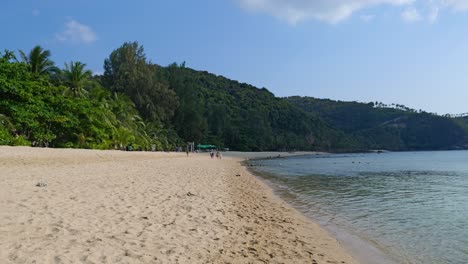 Wide-sand-beach-on-tropical-island-with-few-people