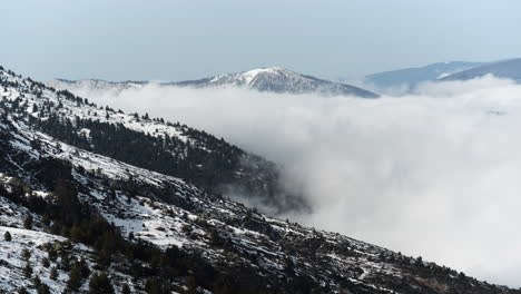 Time-Lapse-Clouds-Moving-Floating-by-Over-The-Snow-Covered-Mountain-slope-day-kaimaktsalan-voras-Greece