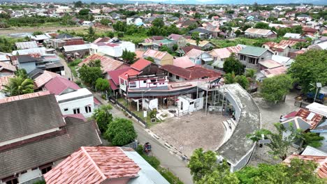 Banda-Aceh-City,-devastating-Tsunami-aftermath,-rooftop-boats,-aerial