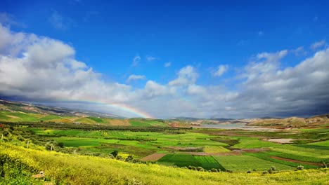 Beautiful-open-field-agriculture-with-rainbow-after-rain-in-North-Morocco