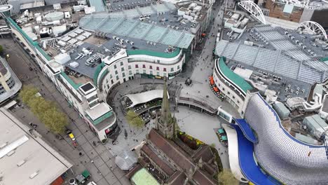 St-Martins-Church-next-to-Bullring-shopping-centre-Birmingham-aerial-panning-up-reveal