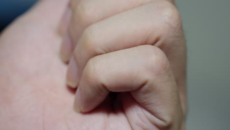 Holding-1000-Rupiah-coin-on-hand.-Close-up