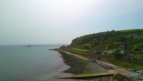 Aerial-shot-of-Whitehead,-a-seaside-village-in-Co