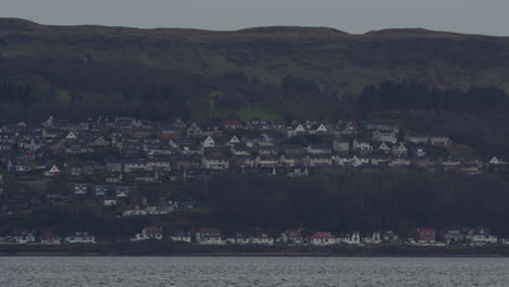 Rows-of-town-homes-along-hillside-with-coastal-views-from-mountain