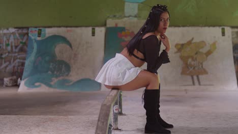 A-mini-skirted-Hispanic-girl-explores-the-indoor-skatepark-with-style