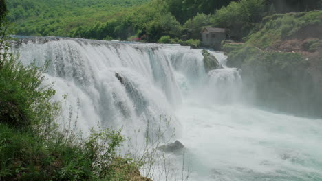 A-waterfall-of-a-pure-wild-river-located-in-a-green-rainforest