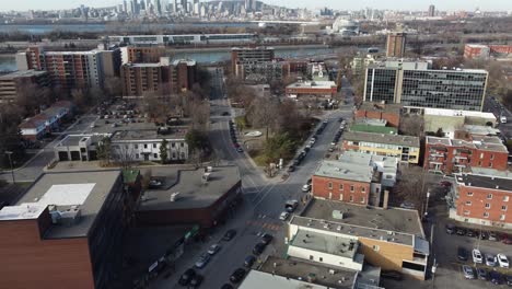 Saint-Lambert,-Quebec-canada-aerial-footage-with-Montreal-cityscape-city-skyline-at-distance-clear-sunny-day