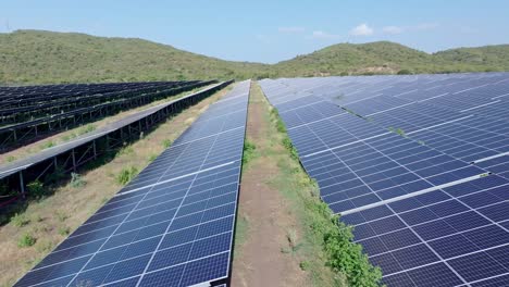 Rows-Of-Solar-Panels-Mounted-On-Field-At-Power-Station-In-Bani,-Dominican-Republic