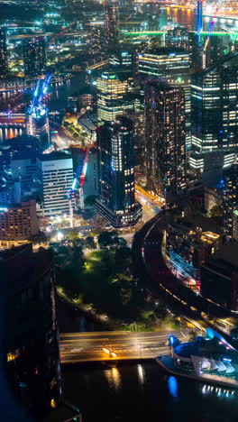 Vertical-4k-Timelapse-Panorama,-Melbourne-Australia-Downtown-at-Night,-Flashy-Colors,-Buildings-and-Buzzing-Traffic