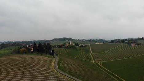 drone-flights-straight-over-the-gavi-hills-full-of-vineyards-during-a-spring-day