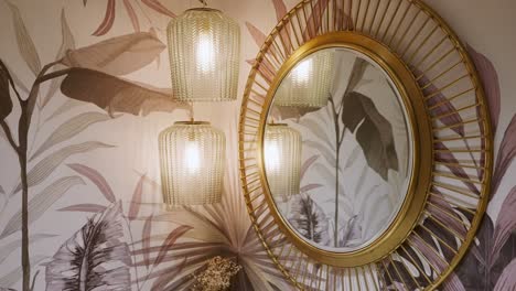 House-Interior-With-Tropical-Wallpaper,-Pendant-Lights,-And-Round-Mirror-On-Wall