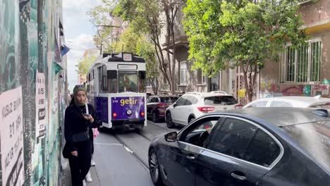Young-Woman-with-Hijab-in-Istanbul-close-to-Tram-in-Kadiköy-District