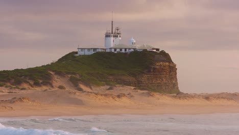 Nobby's-Head-Lighthouse-at-Sunrise,-NSW,-Australia