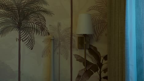 Lampshade-Turns-Off-On-The-Wall-With-Palm-Tree-Design-Wallpaper