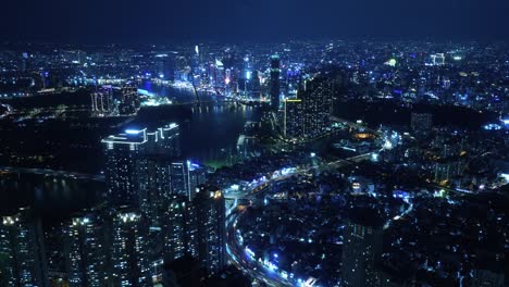 Nightlapse-of-Ho-Chi-Minh-City,-Saigon-Vietnam-at-night-with-the-view-of-the-city-center-with-bright-lights-and-fast-traffic-timelapse