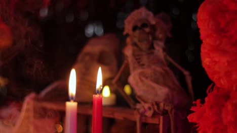 Candles-and-skeletons-close-up-establisher,-focus-switch