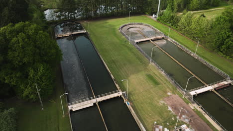 Collierville-wastewater-treatment-plant-in-tennessee,-showcasing-infrastructure-and-green-surroundings,-aerial-view