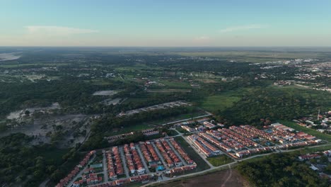 Aerial-Country-Living:-Green-Fields-and-Cozy-Homes