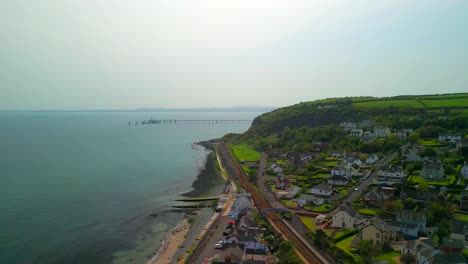 Aerial-shot-of-Whitehead,-a-seaside-village-in-Co