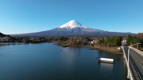 Mount-Fuji-Seen-From-Lake-Kawaguchi-With-Bridge-in-Daytime-In-Fujikawaguchiko,-Yamanashi,-Japan