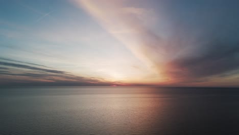 Beautiful-Aerial-Establishing-View-of-Baltic-Sea-Coast-on-a-Sunny-Evening-at-Bernati,-Latvia