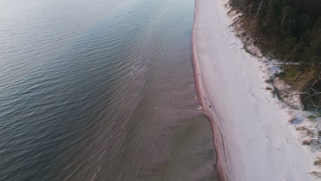 Beautiful-Aerial-Establishing-View-of-Baltic-Sea-Coast-on-a-Sunny-Evening-at-Bernati,-Latvia