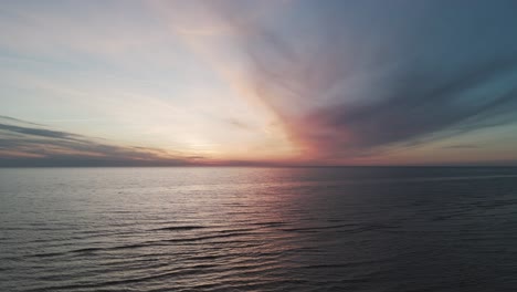 Beautiful-Aerial-Establishing-View-of-Baltic-Sea-Coast-on-a-Sunny-Evening-at-Bernati,-Latvia