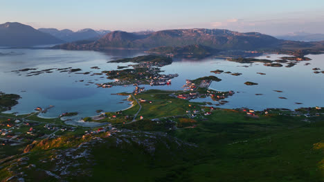 Establishing-drone-overview-of-the-Sommaroy-village,-summer-evening-in-Norway