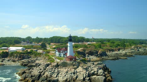 Fast-drone-flyby-and-orbit-of-Portland-Head-light-on-a-sunny-day-on-the-coast-of-Maine