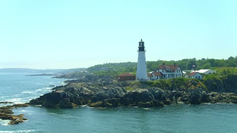 low-orbit-of-Portland-Headlight-lighthouse-on-a-sunny-afternoon-looking-south