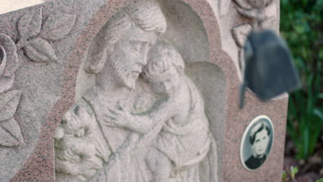 Carving-of-Christ-with-Child-on-Headstone-in-NYC-Cemetery