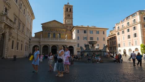 Tourists-Walking-through-Piazza-di-Santa-Maria-in-Trastevere-Neighborhood,-Rome