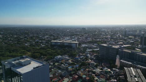 Orbiting-aerial-view-of-city-skyline-in-Alabang,-Las-Piñas,-Philippines