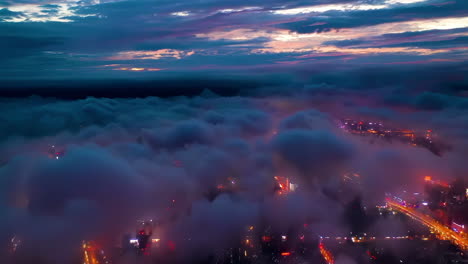 Panoramic-horizon-of-burning-sunset-skies-huge-clouds-above-modern-city-and-skyscrapers