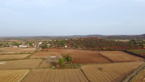 Aerial-drone-shot-of-an-Ancient-Indian-fort-or-castle-in-a-rural-village-of-Gwalior-Madhya-Pradesh-of-India