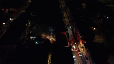 Aerial-Dolly-Shot-Over-Suburban-Neighborhood-with-Emergency-Services-Searching-with-Flashlight,-Montréal,-Québec,-Canada