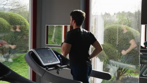 Athlete-run-and-train-cardio-endurance-on-treadmill,-indoor-gym-membership