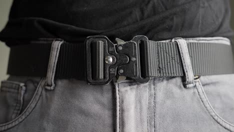 Tactical-belt-click-close,-secure,-fastened,-locked,-clothing,-slow-mo