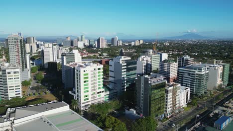 Scenic-aerial-flyover-shot-of-cityscape-and-buildings-in-Alabang,-Las-Piñas,-Philippines