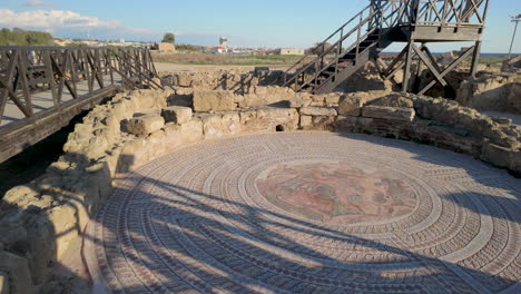 A-beautifully-preserved-mosaic-floor-at-the-Kato-Pafos-archaeological-site,-featuring-intricate-designs-and-central-figural-art