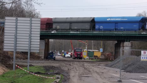 Railroad-bridge-reconstruction-at-Rudna-and-Ostravska-street-between-Havirov-and-Senov-in-Czech-Republic,-train-passing-by