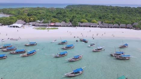 Boats-on-White-Sand-Beach-of-Kwale-Island,-Tourist-Travel-Destination-of-Zanzibar