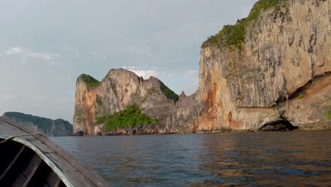 POV-View-From-LongTail-Boat-as-it-Sails-Along-Maya-Bay-Island-Cliffs--Koh-Phi-Phi-Island,-Krabi-Thailand
