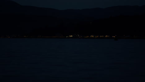 Distant-lights-of-seaside-town-at-night