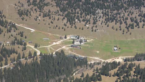 Aerial-view-of-Alpine-resort-with-chairlift,-seasonal-for-skiing-and-mountain-biking-holidays