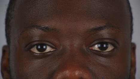 Close-Up-Of-Black-Male-Eyes-Staring-Into-Camera