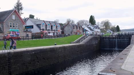 View-of-Fort-Augustus-with-Caledonian-Canal,-shops,-cafes,-and-accommodation-in-the-highlands-of-Scotland-UK