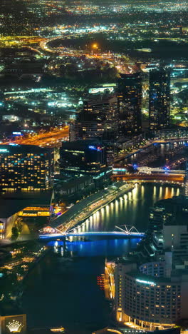 Vertical-4k-Timelapse,-Melbourne-Australia-Downtown-District-at-Night,-Flashy-Colors,-Buildings,-Bridges-and-Street-Traffic